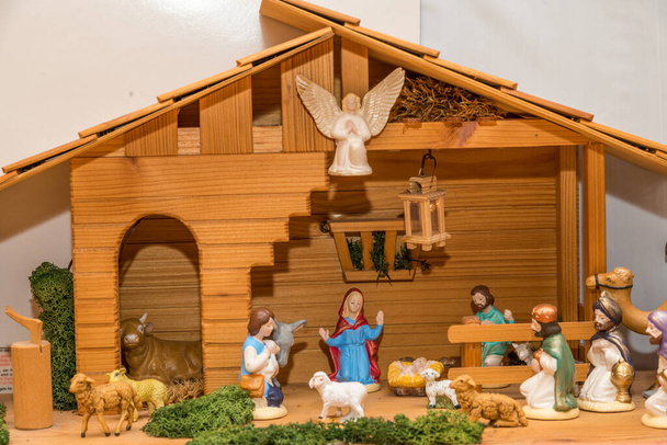 painted crib figures in wooden crib - atmospheric Christmas crib - Photo, Image