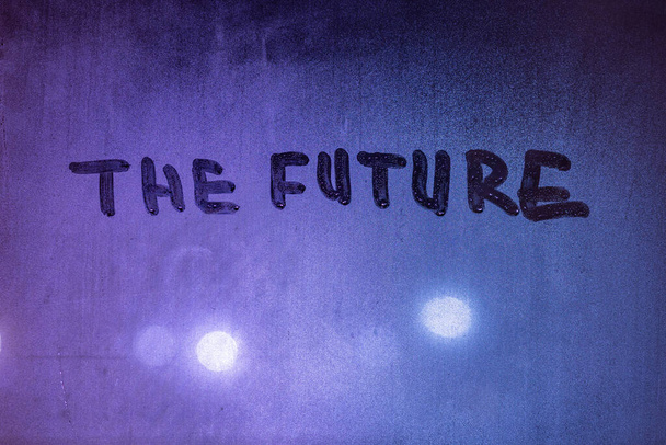 word the future handwritten on night υγρό παράθυρο γυαλί επιφάνεια - Φωτογραφία, εικόνα