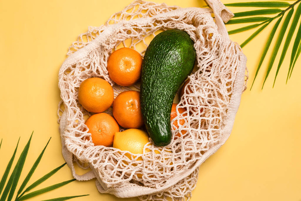Organic fruits and vegetables in reusable and zero waste mesh cotton shopping bag. Eco bag, plastic free concept. - Photo, Image