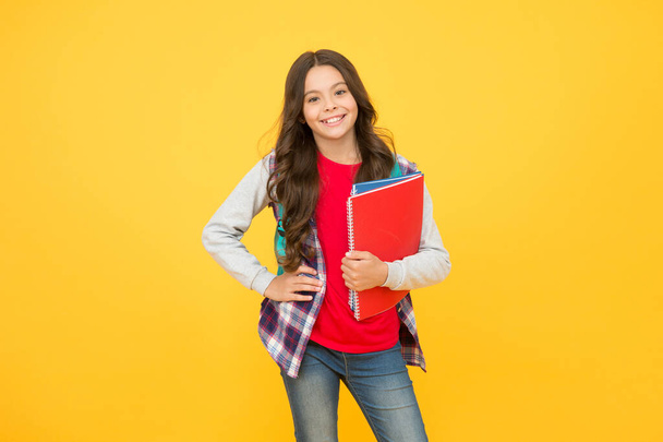 Happy child in casual fashion style hold school books for learning, education - Foto, Imagem