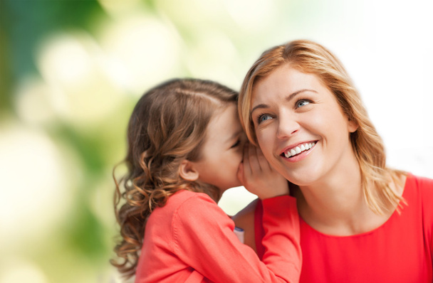 Smiling mother and daughter whispering gossip - Foto, Bild