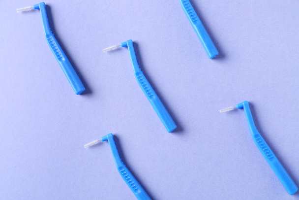 Toothbrushes for dental braces on color background - Φωτογραφία, εικόνα