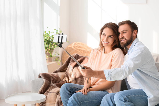 Young couple taking selfie at home - Photo, Image