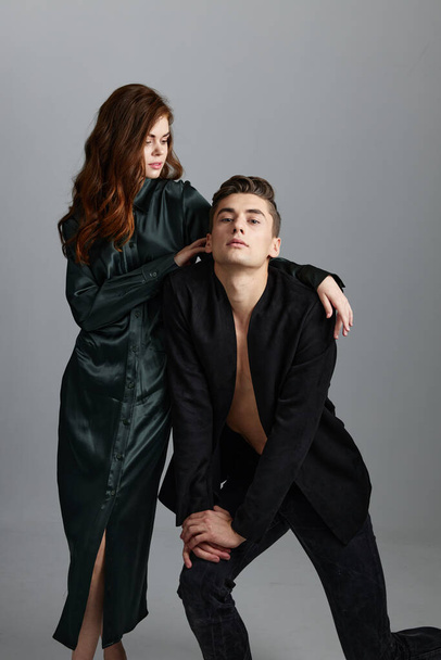 A man knelt down and a sexy woman in an evening dress - Zdjęcie, obraz