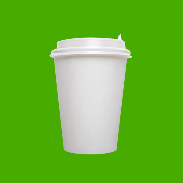 White paper coffee disposable cup with plastic lid isolated on bright green background. Concept for mockup and template with copy space and brand. - Photo, Image