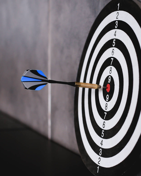 Dart is an opportunity and Dartboard is the target and goal.So both of that represent a challenge in business marketing as concept. - Photo, Image