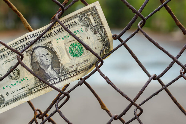 money stuck in an iron cage, seized finances - 写真・画像
