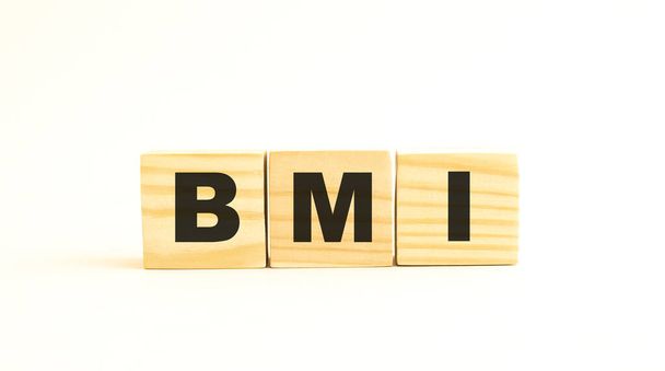 The word BMI. Wooden cubes with letters isolated on white background. Conceptual image. - Valokuva, kuva
