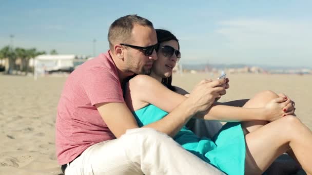 Couple with smartphone - Кадри, відео