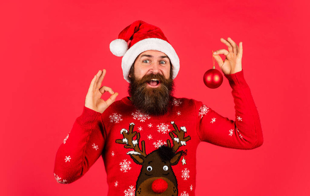 Optimism concept. Better days coming. Winter inspiration. New year party decor. Prepare for holiday. Bearded hipster man hold christmas decoration. Decorate your home. Run xmas party. Organise party - Foto, imagen