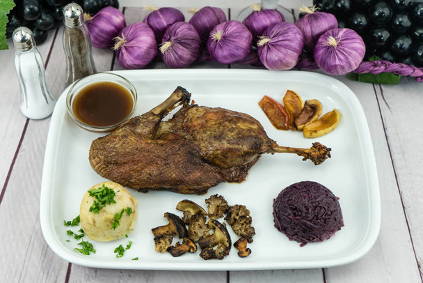 Baked Duck with red cabbage and forest mushrooms - Фото, зображення