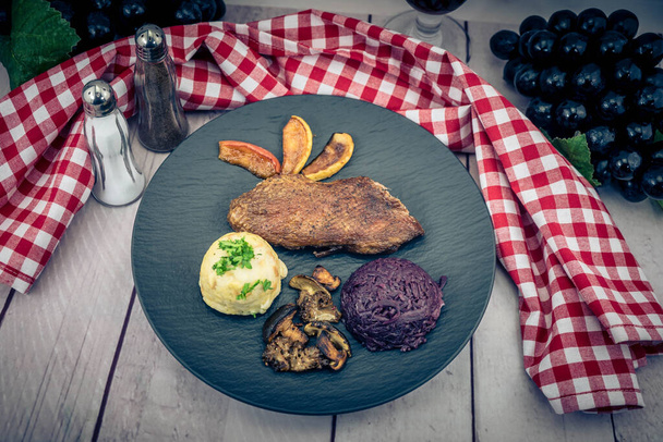 Baked Duck with red cabbage and forest mushrooms - 写真・画像