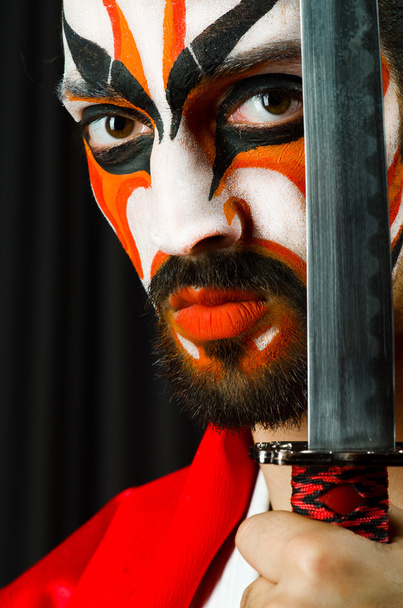 Man with sword and face mask - Photo, Image