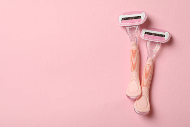 Two razors on pink background, space for text - Photo, Image