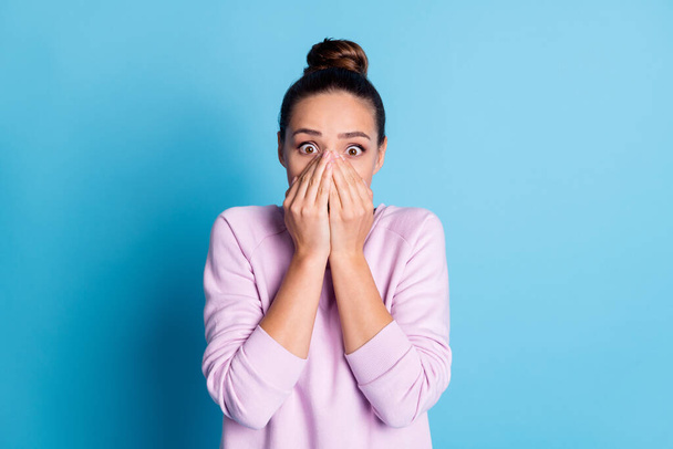 Photo of astonished speechless voiceless girl close cover face hands impressed crazy incredible long wait want gift wear violet pullover isolated over blue color background - Foto, Imagem