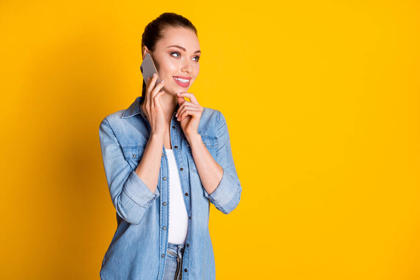 Photo of curious girl call friend smartphone listen weekend summer plans touch chin finger look copyspace think thoughts wear stylish trendy outfit isolated bright shine color background - Φωτογραφία, εικόνα