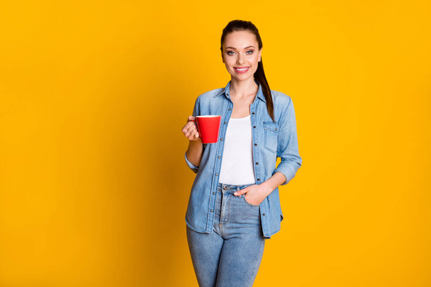 Portrait of cool pretty girl hold cup with hot latte enjoy free time break wear casual style clothes isolated over shine color background - Photo, image