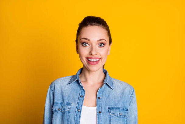 Portrait of astonished crazy girl look good in camera impressed novelty scream wear denim shirt isolated over vivid color background - Photo, image