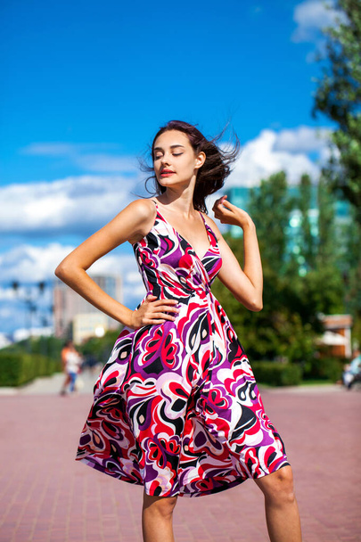 Portrait of a Young beautiful brunette girl in summer dress - Fotó, kép