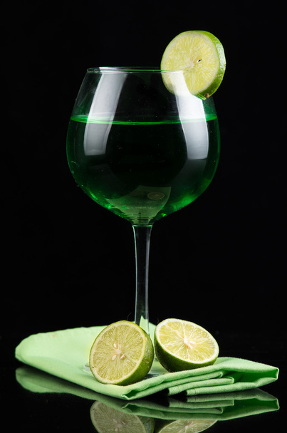Lemon drink in a wine glass - Foto, Imagen