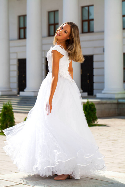 Young beautiful schoolgirl in ballroom prom dress - Fotografie, Obrázek
