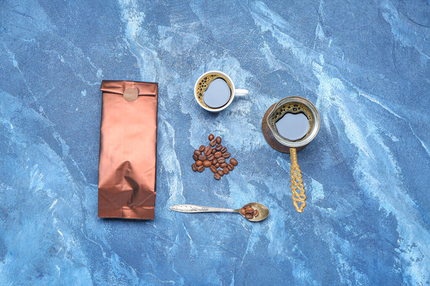 Composition with coffee bag, cup and jezve on color background - Foto, immagini