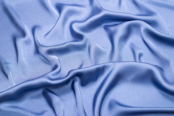 Blue silk or satin luxury fabric texture. Top view. - Fotoğraf, Görsel