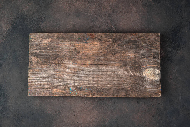 Background with wooden Board on concrete brown background. - Photo, Image