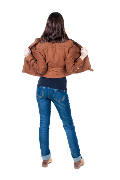 Brunette woman in brown jacket - 写真・画像