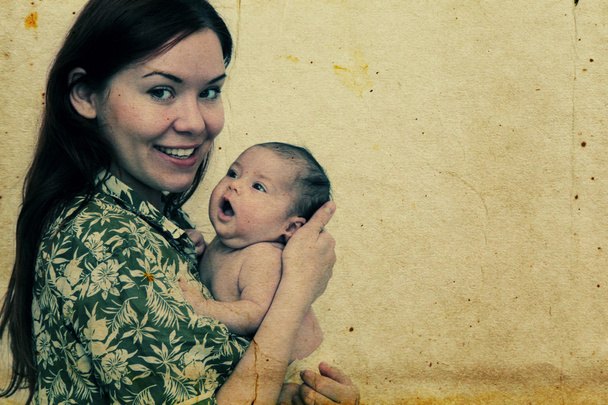 young mother with her baby. Photo in old image style - Photo, image