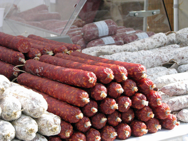 sausage and spicy salami on sale at a butcher's stall - Photo, Image