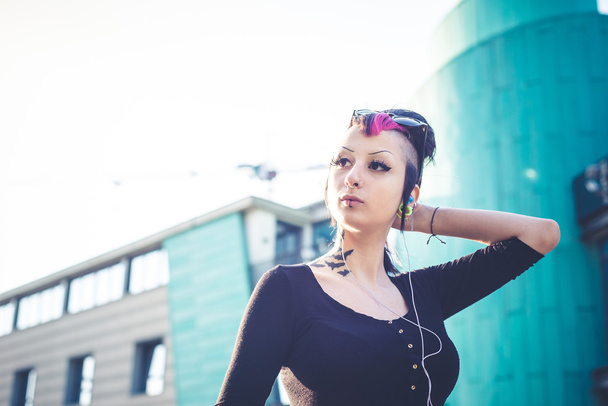 Punk girl listening music - Foto, imagen