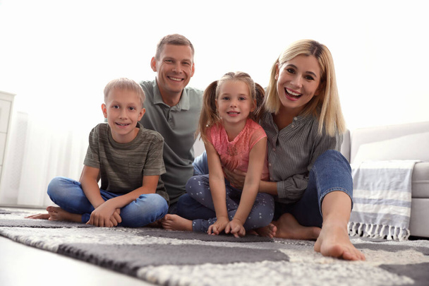 Happy family with children on floor at home - Fotoğraf, Görsel