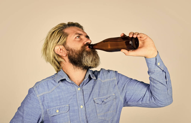 Alcohol drink. Sparkling water drink. Cold beverage. Learn how to make beer at home. Making Homemade Kombucha. Refreshing lemonade. Soda drink. Hipster at bar. Man beard and mustache hold bottle - Photo, Image