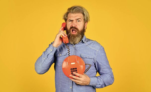 Bearded hipster man phone conversation. Call clients. Retro phone. Marketing automation. Calling on Past Customers Script. Outdated technology. Manager phone communication. Answering machine - Photo, image
