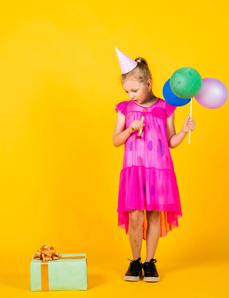cute kid in dress hold party balloons and gift box, party - Foto, imagen
