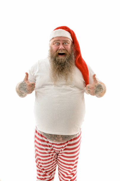 Emotional fat funny and tattooed man isolated on a white background - Fotoğraf, Görsel