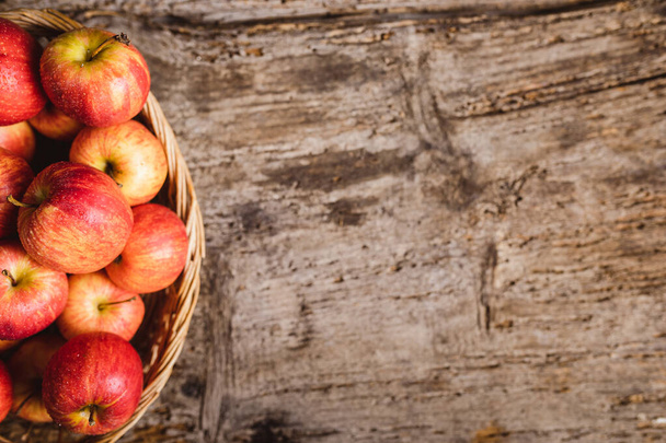 Ripe red apples on wooden table  - Fotoğraf, Görsel