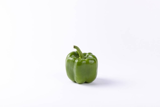 A green Bulgarian pepper isolated on a white background - Фото, изображение