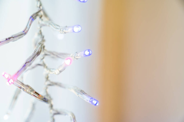 A closeup shot of Christmas tree led lights isolated on a plain background - Fotó, kép