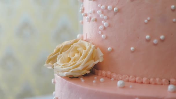 Rose of cream, butter on a beautiful sweet cake. High-calorie carbohydrate product. High-calorie, fatty food. Snack for stress. Dessert for the festive table. Close-up - Footage, Video