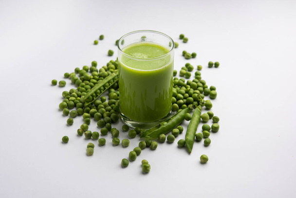 Green Peas Fresh Juice or smoothie or drink made using watana or vatana, Indian healthy green beverage served in a glass - Photo, image
