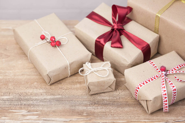 Christmas background with gift boxes  on wooden background - Fotó, kép