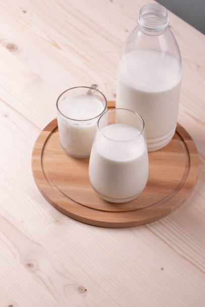 white eggs and milk as calcium concept. minimalism style. - Zdjęcie, obraz