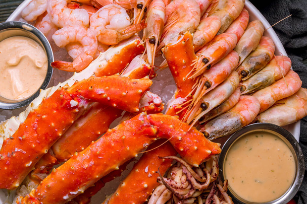 assorted seafood on ice, crab, shrimps, prawns, squid - 写真・画像