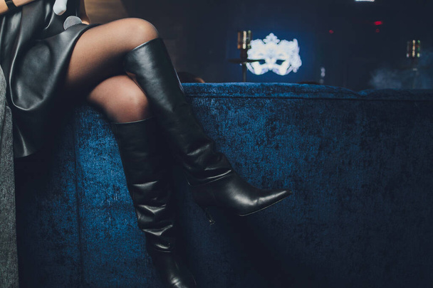 style. fashion. shoes. high womens black boots. beautiful female legs. - 写真・画像