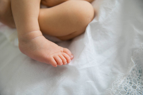 small childs bare foot. smooth, soft heels. - Фото, зображення