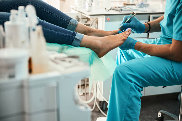 Professional doctor podiatrist doing medical pedicure procedure in the cabinet - Photo, Image
