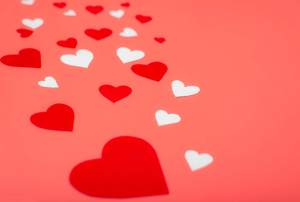 Hearts on a red background. Background for Valentine's Day, postcard. - Φωτογραφία, εικόνα