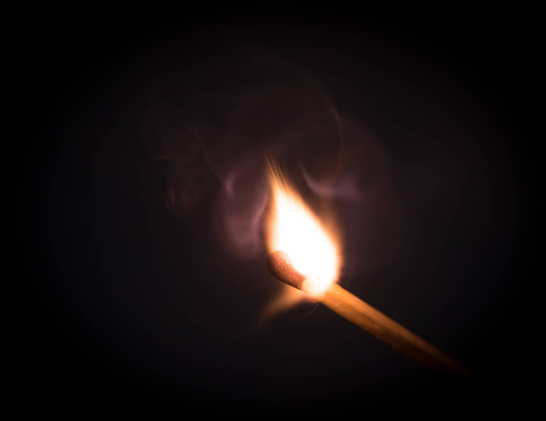 Fire burning on matchstick. Isolated on black  background. - Photo, Image
